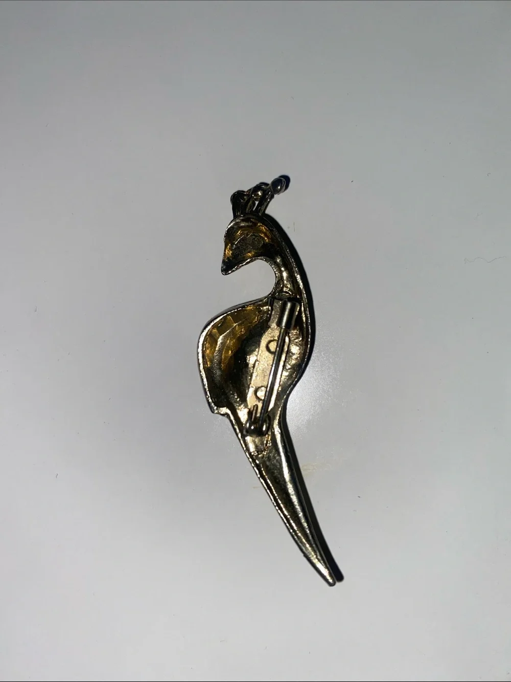 Gold-Tone Peacock Brooch with Deep Blue Crystal